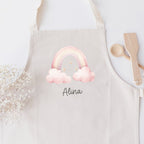 Kinderschürze (personalisiert mit Name) mit "Regenbogen in rosa Wolken"-Motiv