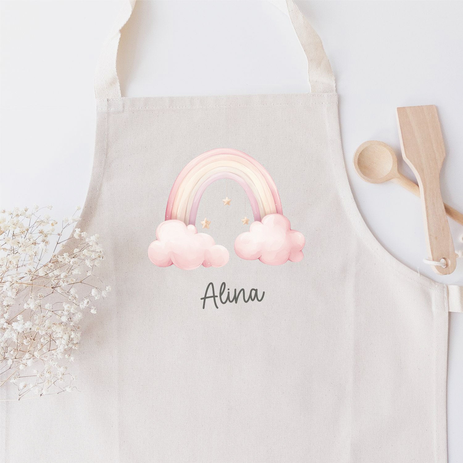 Kinderschürze (personalisiert mit Name) mit "Regenbogen in rosa Wolken"-Motiv