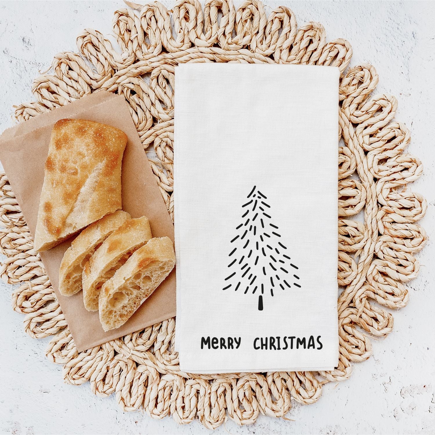 Weißes Geschirrtuch mit schwarzer Tannenbaum-Grafik und "MERRY CHRISTMAS" -Aufdruck