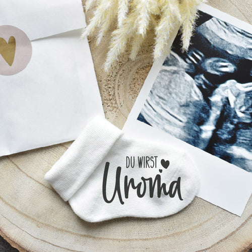Geschenkidee: Babysocke "Du wirst Uroma", um der Oma deine Schwangerschaft zu verkünden