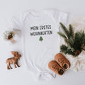 Weihnachts-Babybody "Mein erstes Weihnachten" mit grünen Tannenbäumchen als Weihnachtsgeschenk fürs Baby